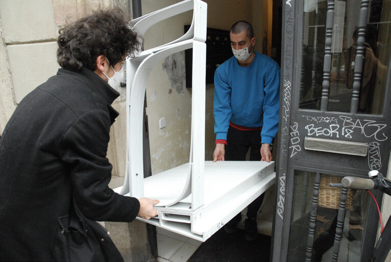 A finished component carried to the doorway it was printed for.