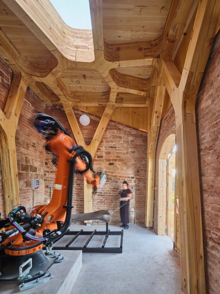 Operating the robotic arm with its control pendant.