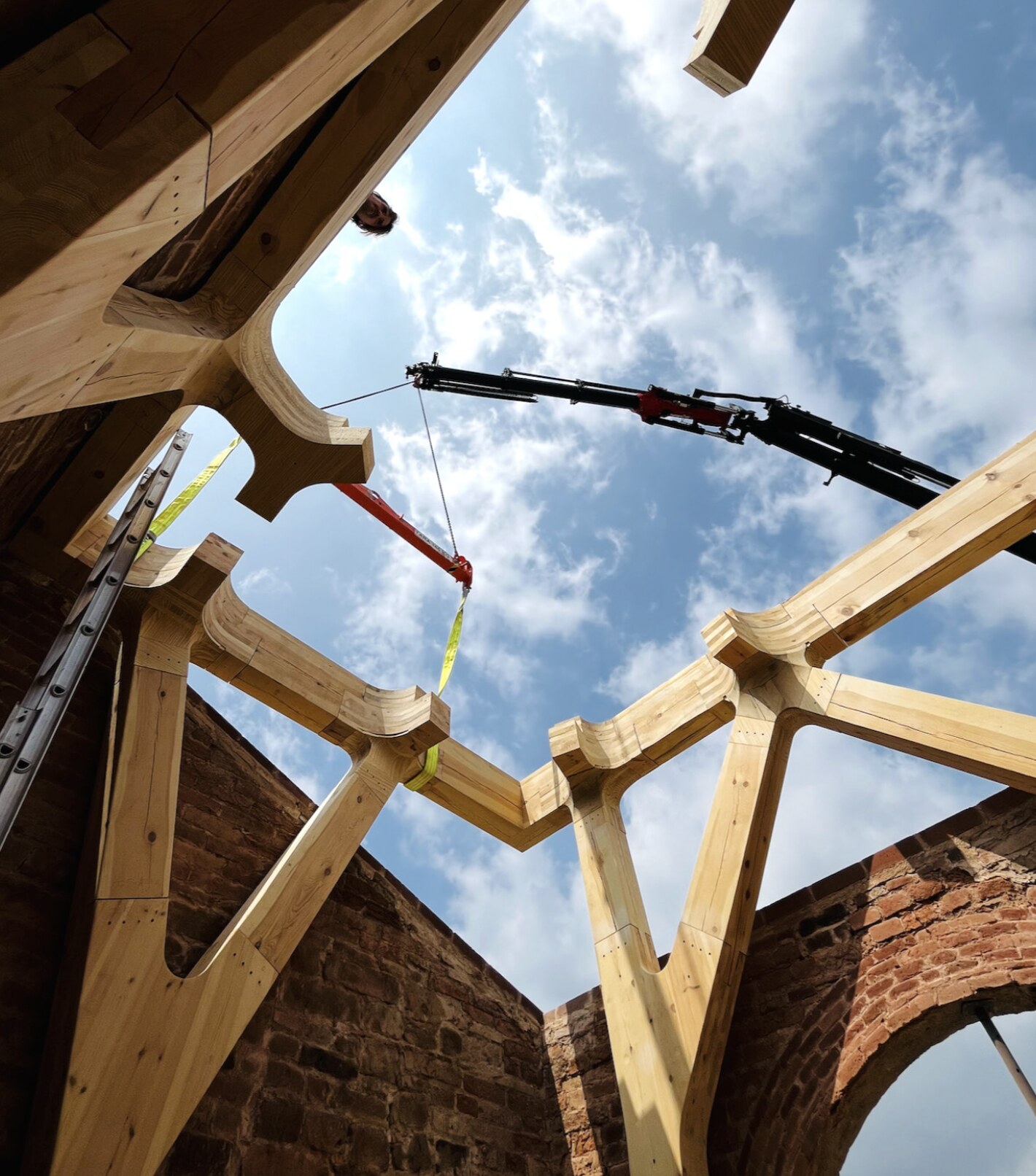 A node swung into position, seen from beneath the frame.