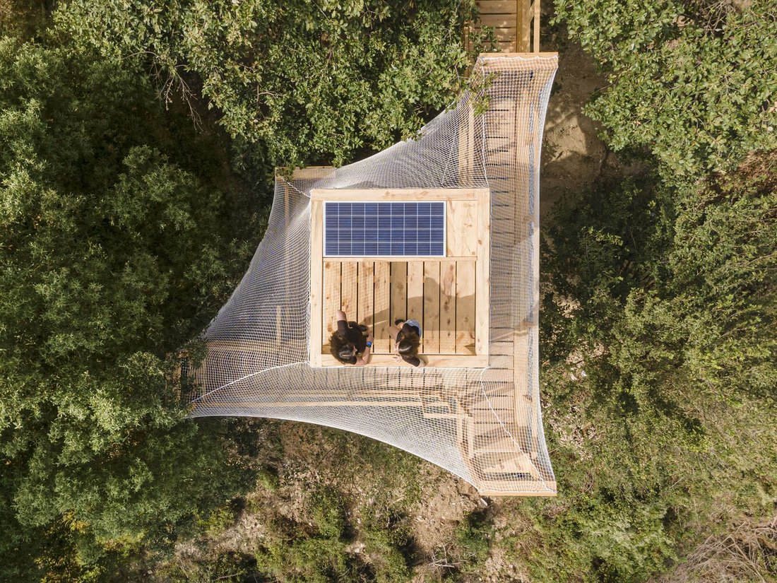 Aerial view showing the rooftop photovoltaic array.