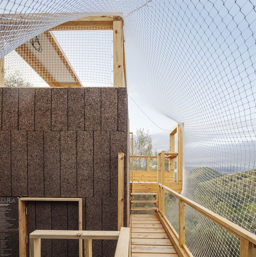 Regenerative cork cladding of the observation core along the enmeshed walkway.
