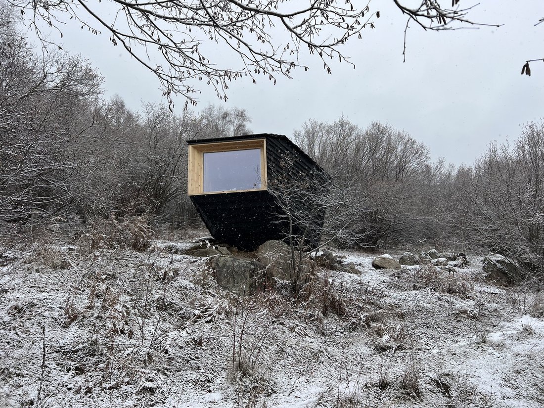 A dusting of snow on the boulders.