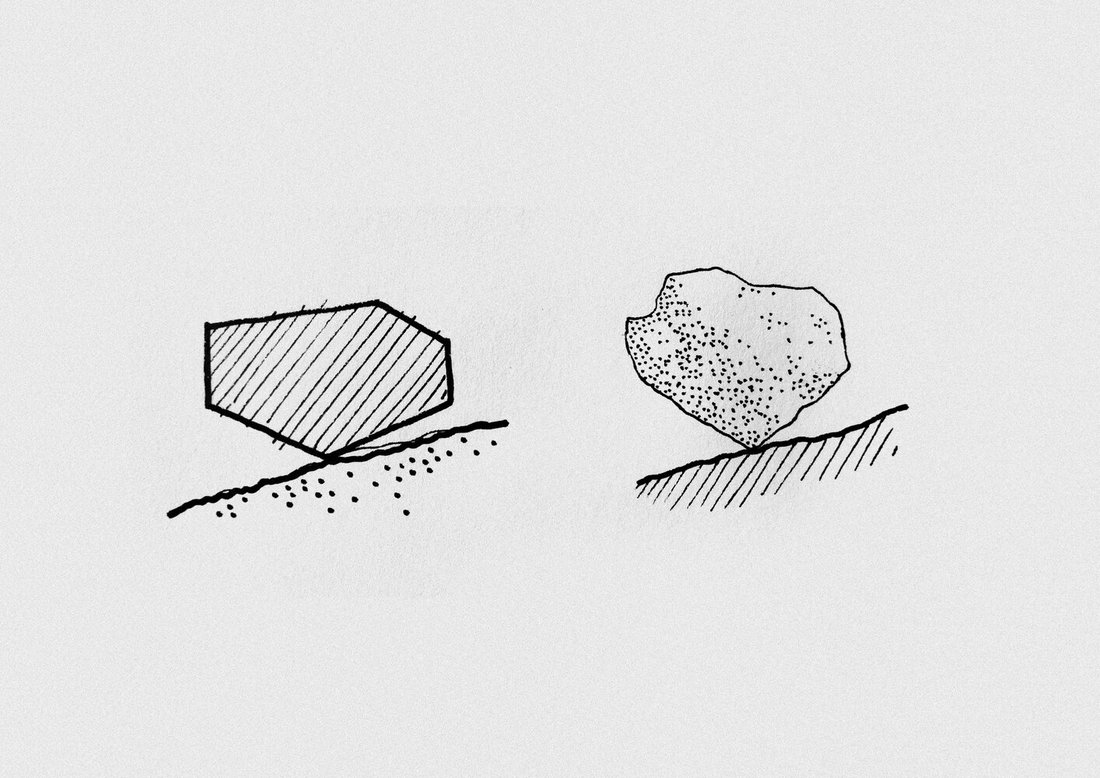Foundation concept — resting on the boulders, not cutting into them.