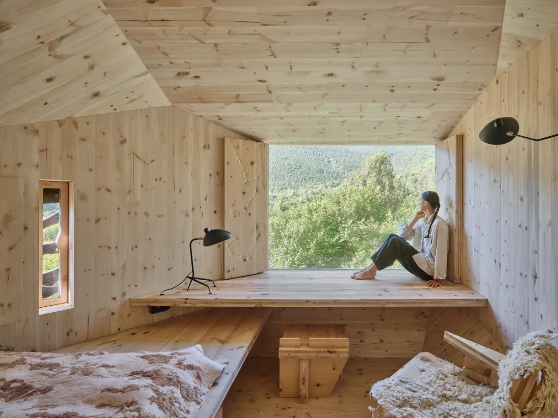 Interior — window seat framing the valley.