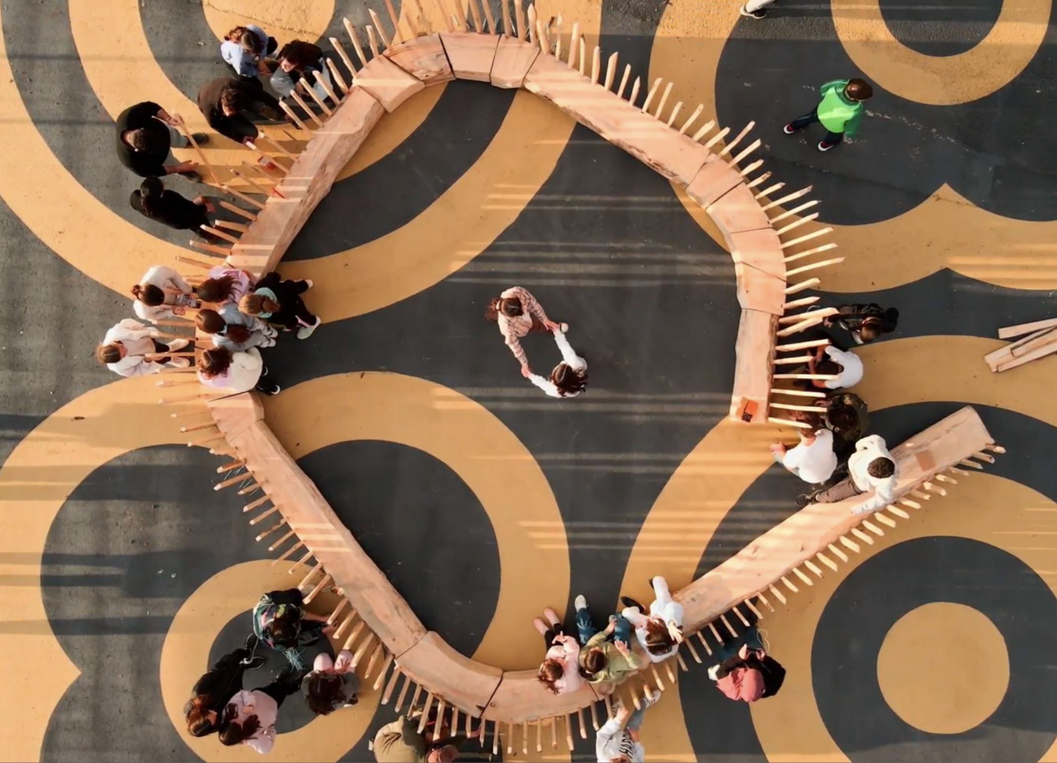El Cargol by IAAC, students playing along the spiral form at the Plaça de les Glòries Catalanes, Barcelona, Spain.