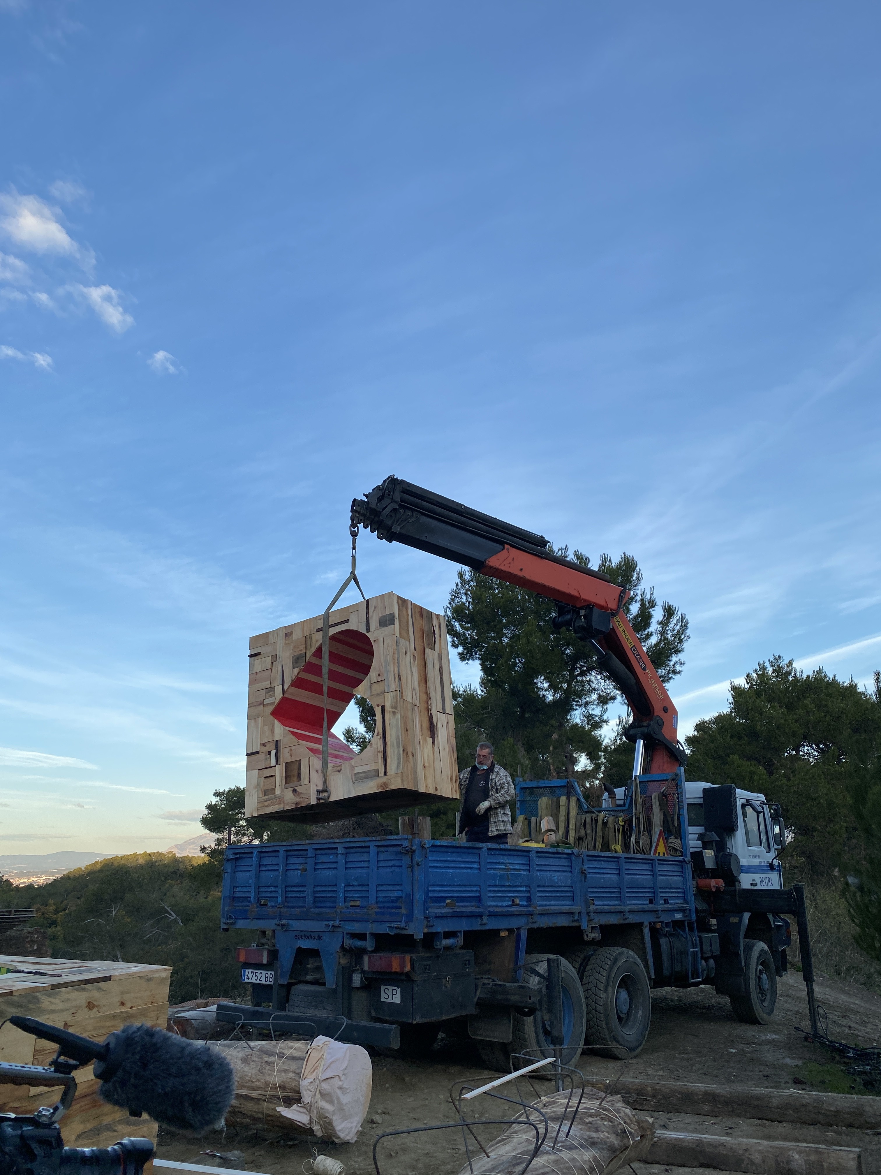 The waste-box modules arrive by crane on installation day.