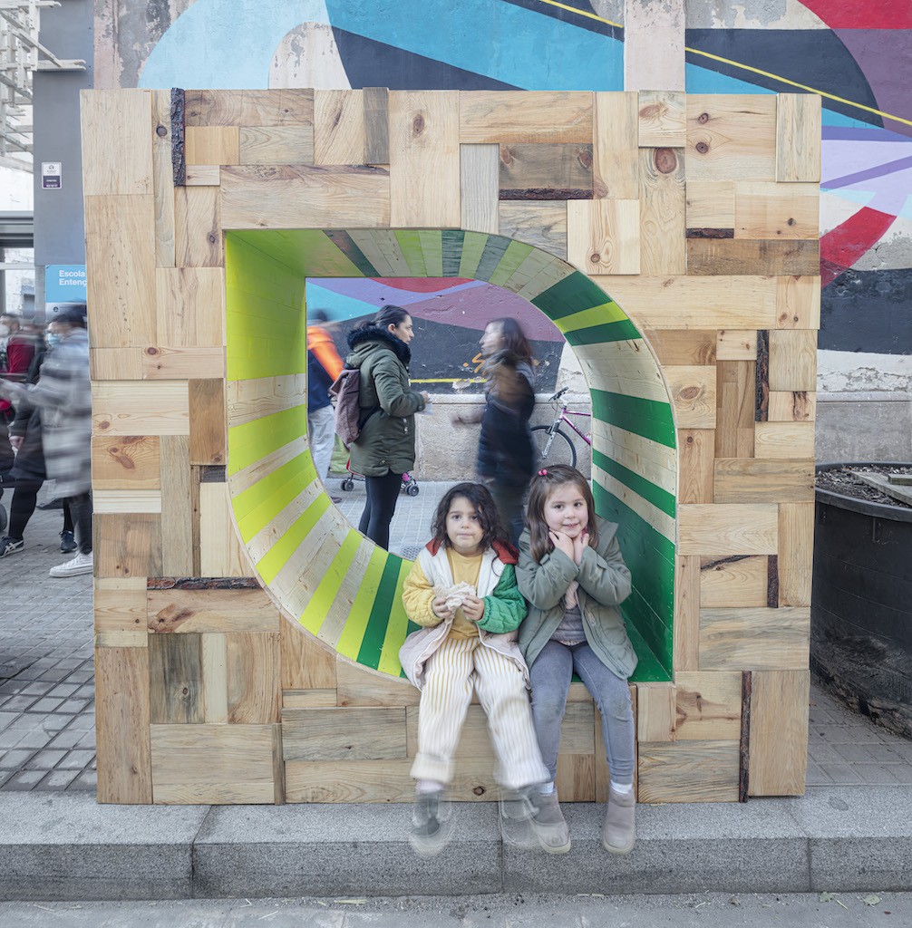 A second occupiable waste-wood frame.