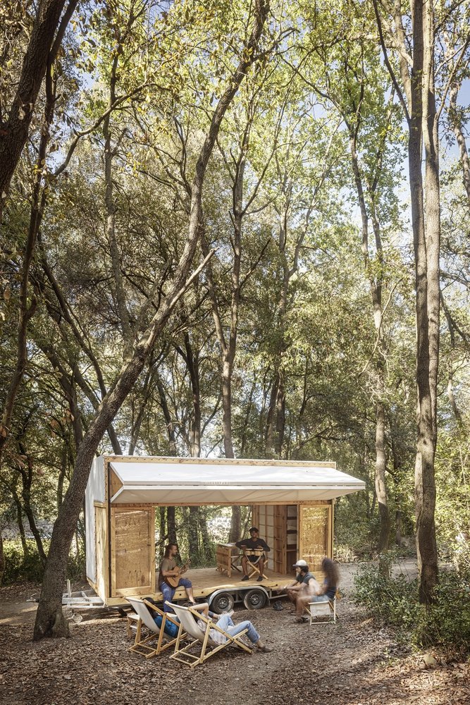 Awning out, guitars out, in a clearing at Valldaura.
