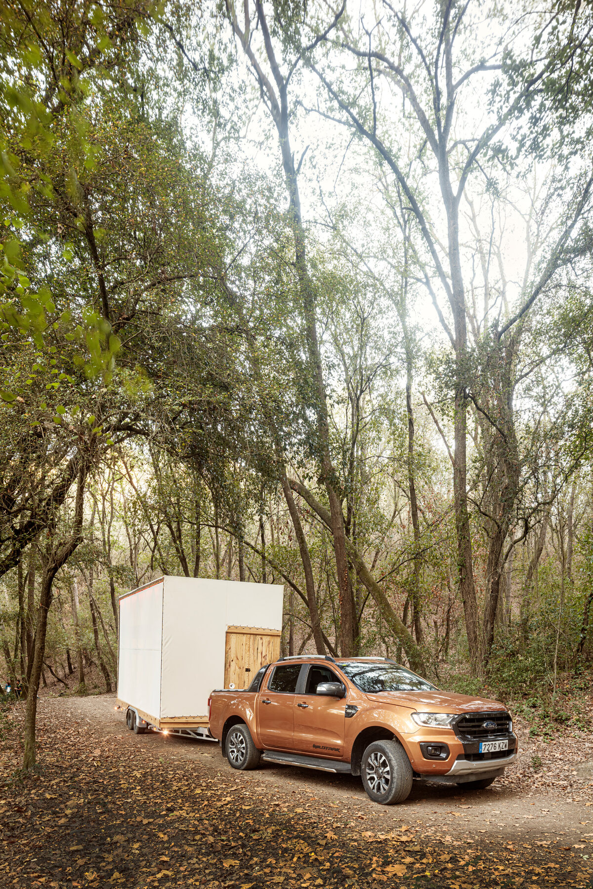 Towed into position — the building arrives by road.