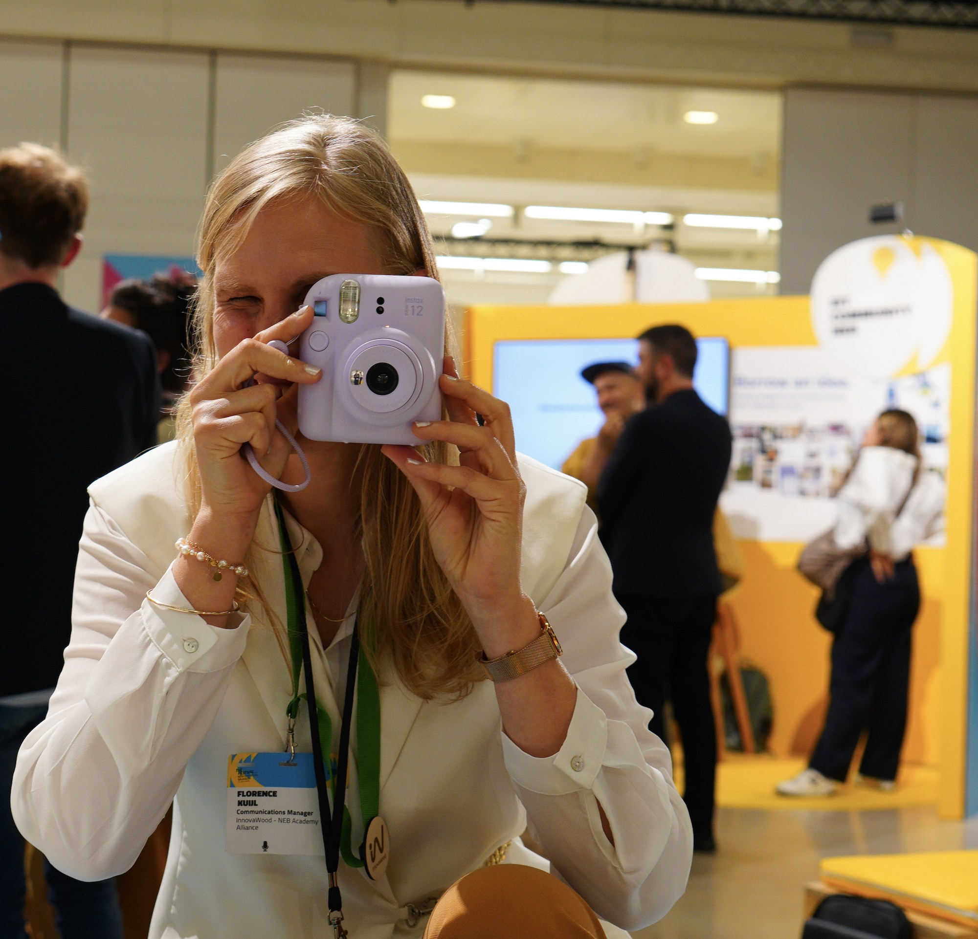Florence Kuijl (InnovaWood) documenting the NEBA Alliance booth at NEB Festival 2026.