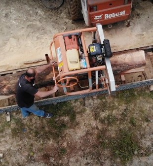 Milling lumber on site.