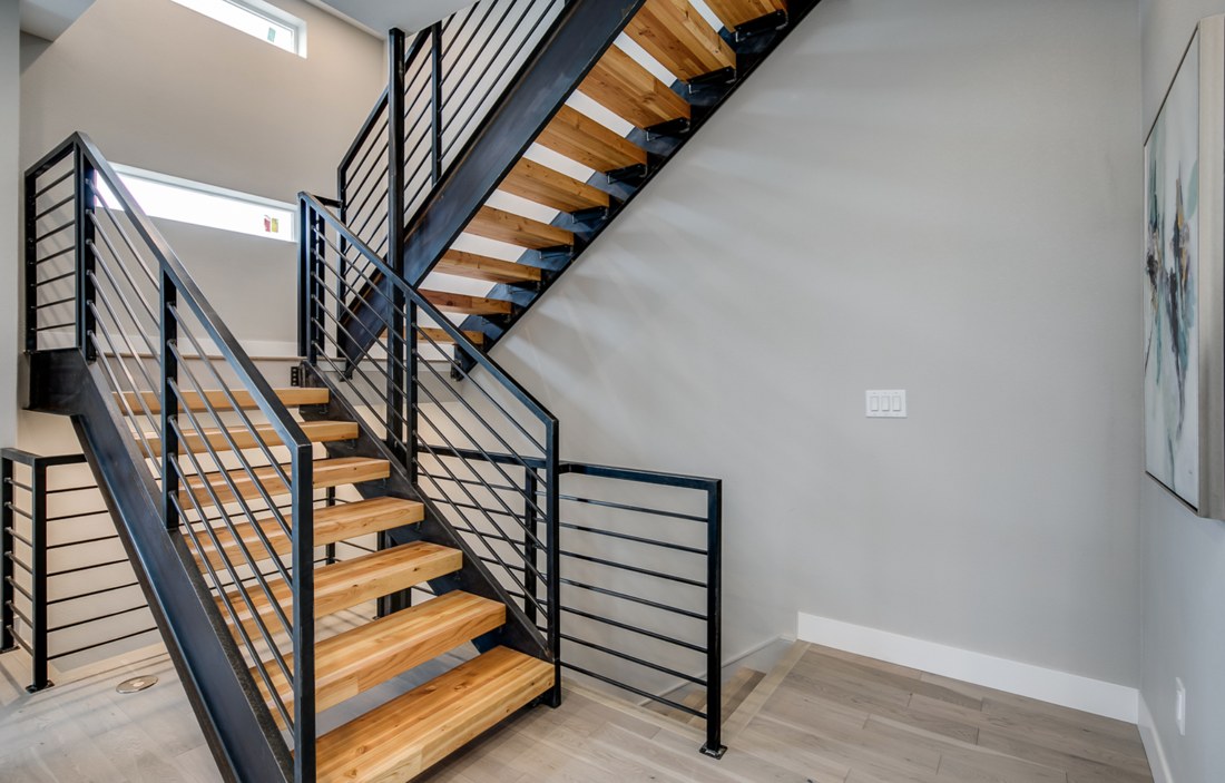 Custom steel stair with laminated wood treads.