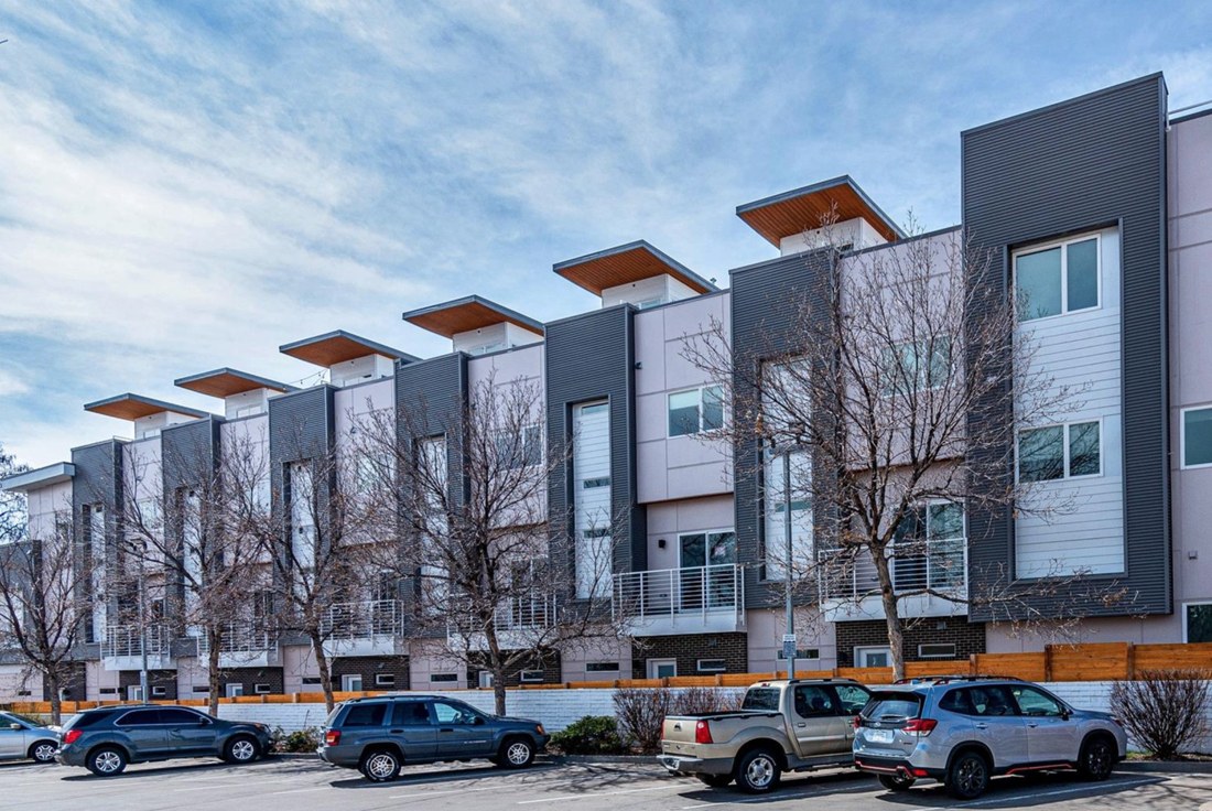 17 units cascade down the sloped site, with individual architectures adapted to appear aligned and unified.