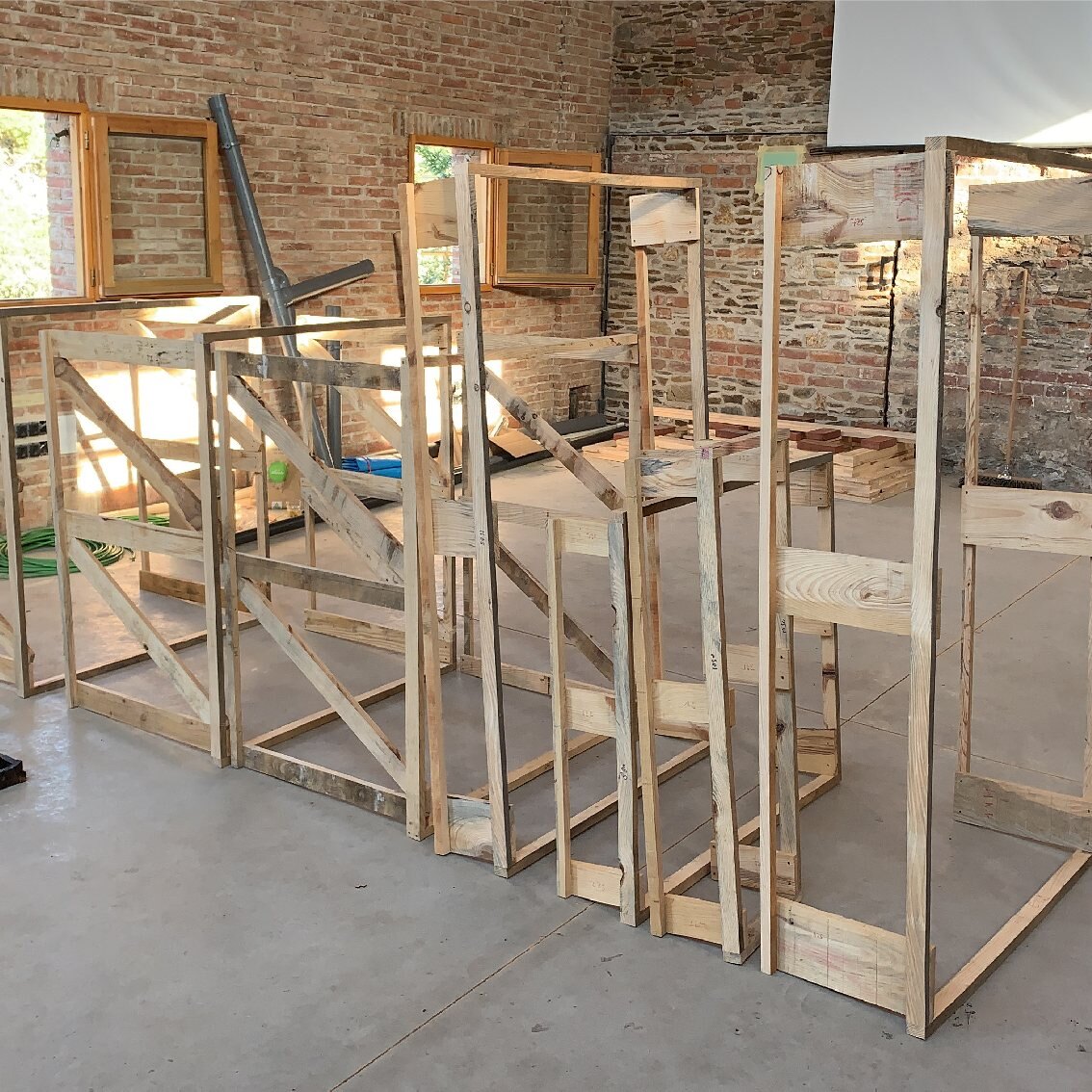 Frames lend the facade volume and contain mechanical installations, assembled in the workshop before transport to site.