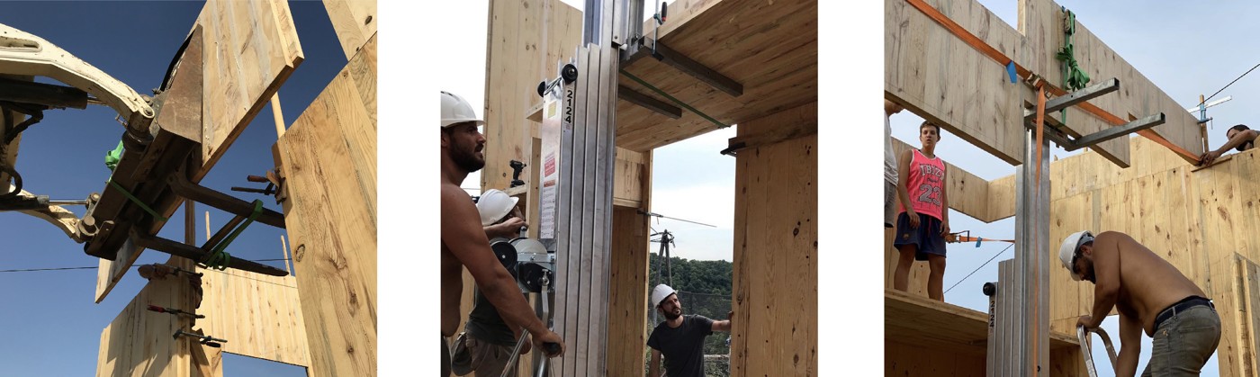 Lifting and setting modular CLT panels during the off-site preassembly.